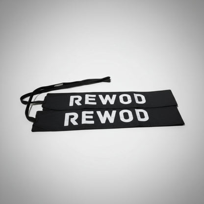 Black resistance bands with 'REWOD' text on a white background