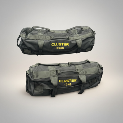 Two Cluster sandbags with visible weight labels on a gray background