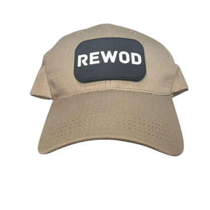 Beige cap with a black patch displaying 'REWOD' on a white background